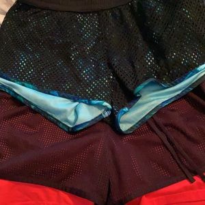 Two pairs of athletic shorts. Women’s medium